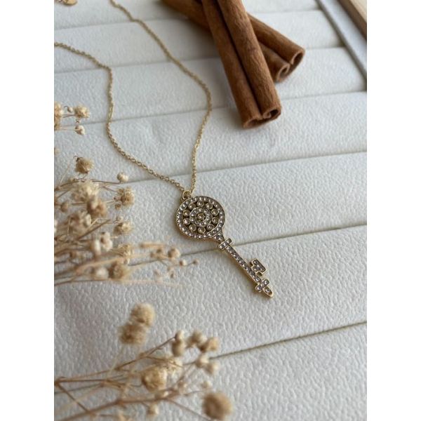 Collier Clé circulaire à zircons