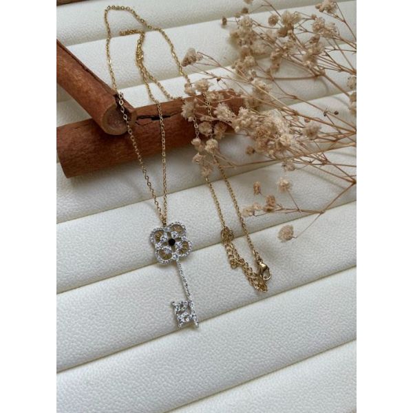 Collier clé diamant blanc