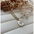 Collier disque doré coeur diamant